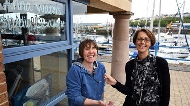Clare Stowell from the Port of Milford Haven welcomes new tenant Anna Waters to Milford Waterfront